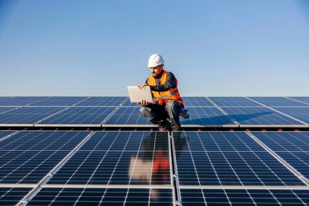 Home Impex Solar installation technician working on rooftop panel